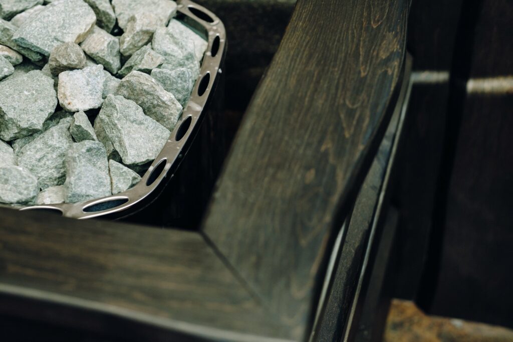 electric sauna heater with stones in the sauna